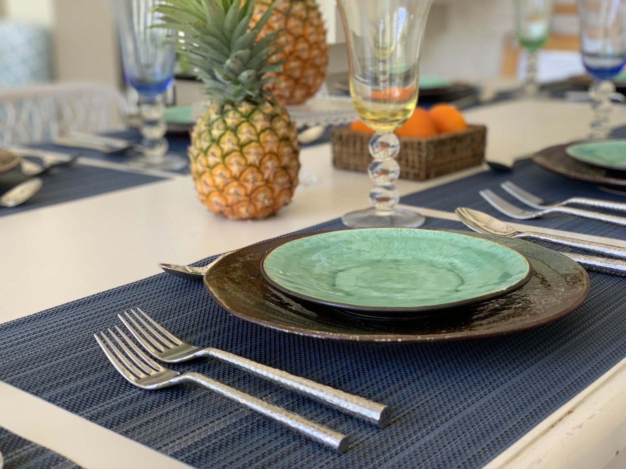 Outdoor table prepared for a tropical meal